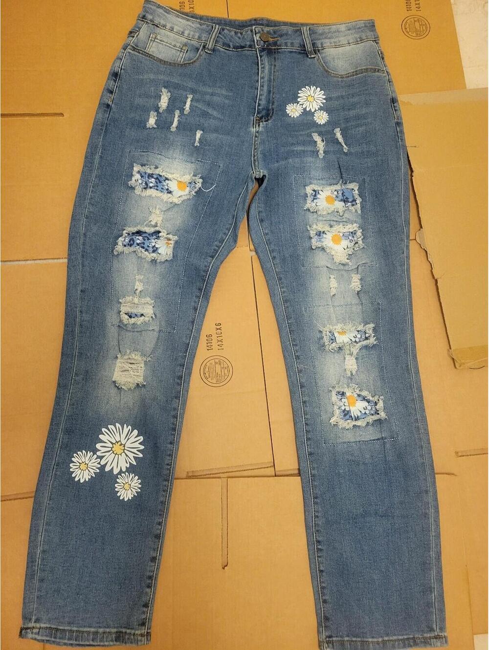 Women's Jeans featuring distressed patchwork details and daisy flowers. Size XL